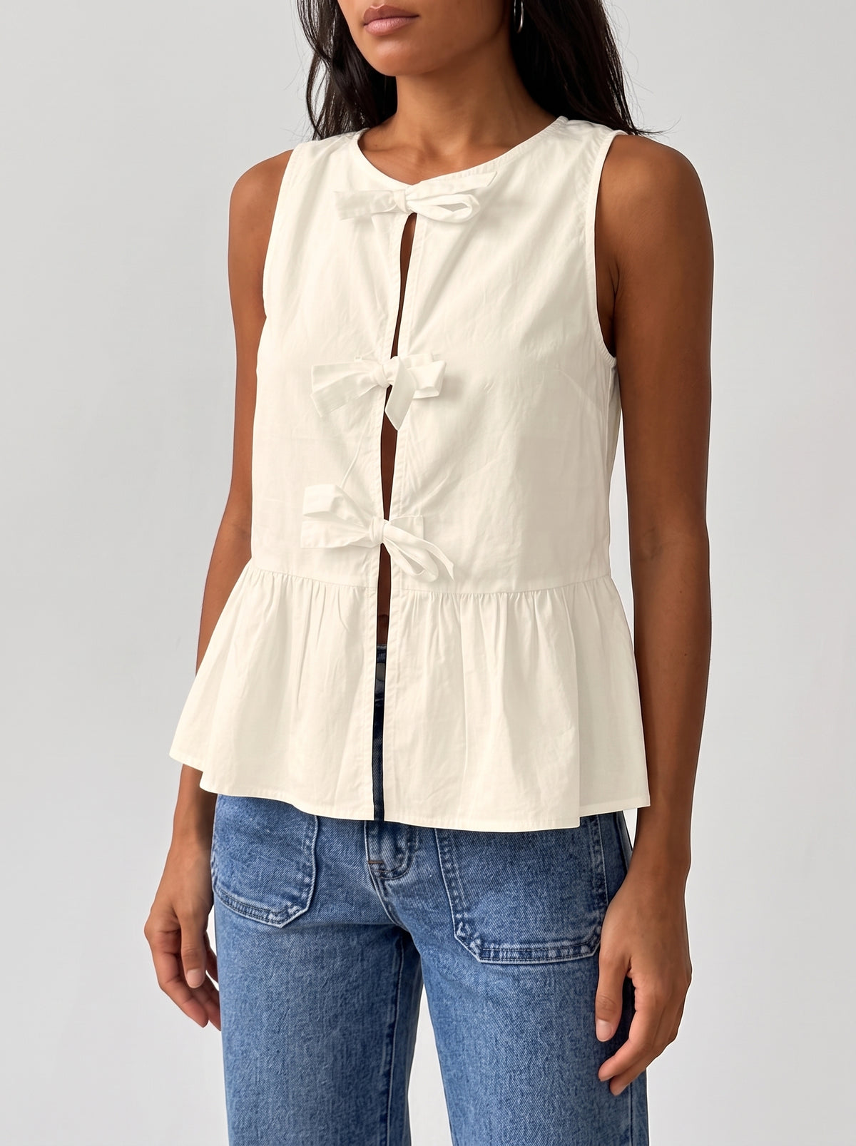 Bianca Sleeveless Bow Peplum Top — Beige