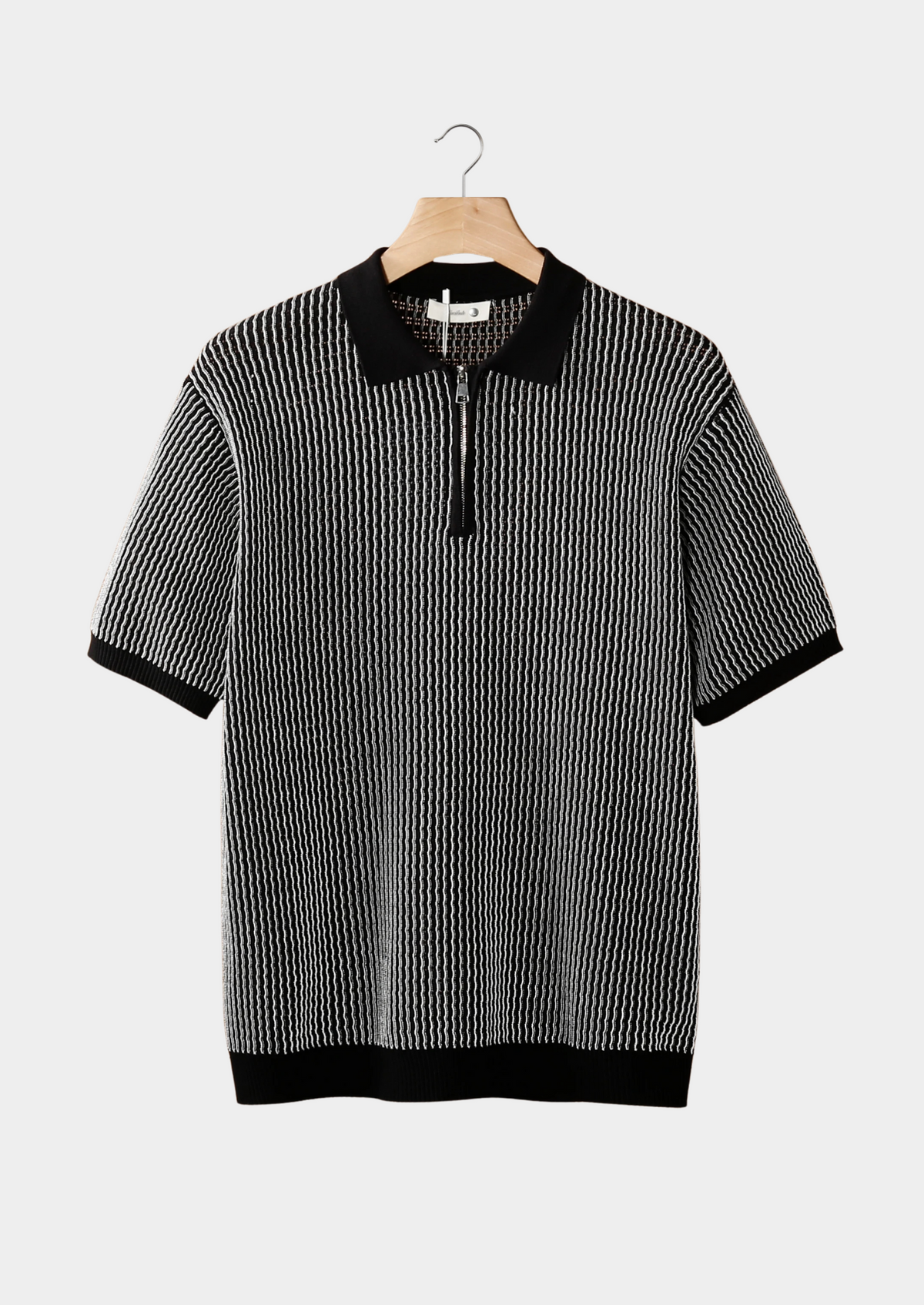 Polo zippé texturé géométrique noir
