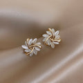 Sonja Luxe · Boucles d'oreilles en opale blanche