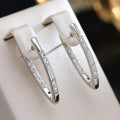 Sylvia · Boucles d'oreilles élégantes en zircone