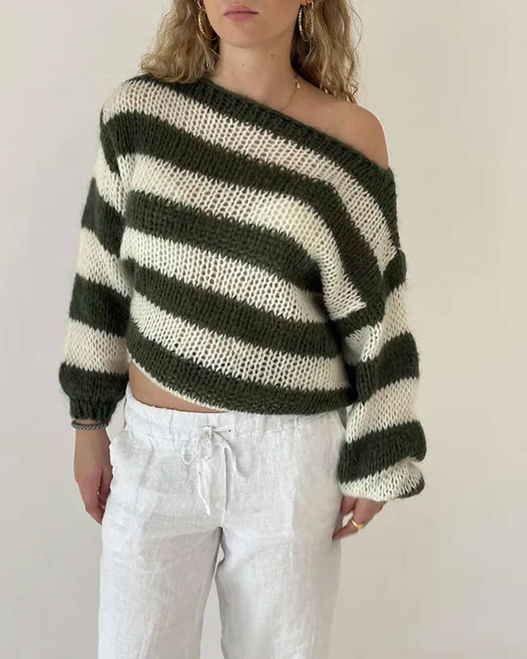 Pull rose à rayures et coupe ample