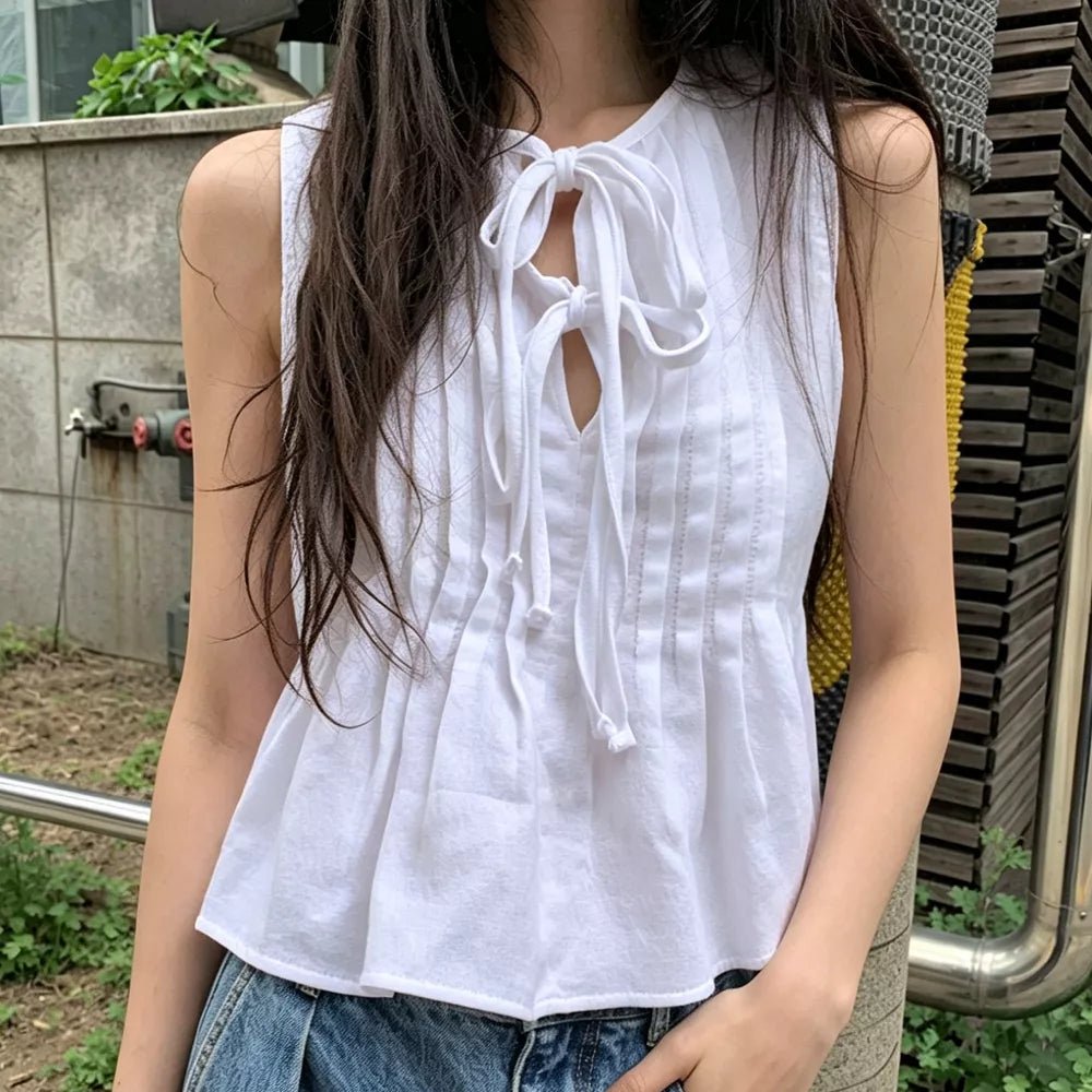 Top Honora avec volant et nœud sur le devant