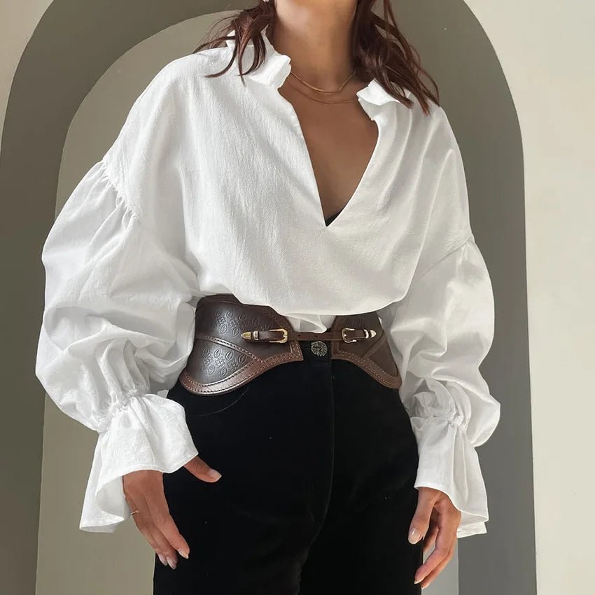 Lola Blouse à col V. Manches bouffantes. Manches longues.